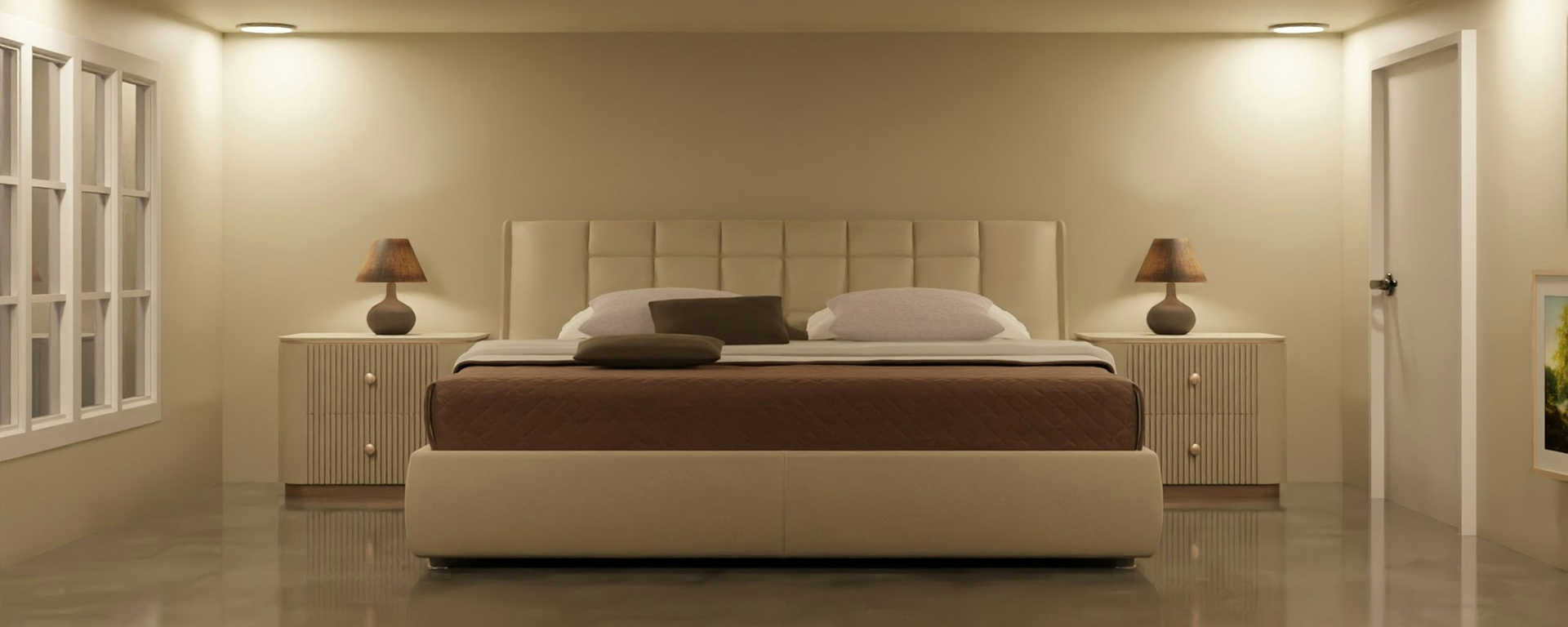 A warm, softly lit bedroom furnished for comfort